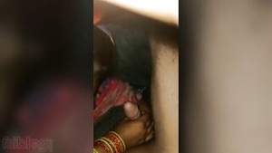 Desi bhabhi gives blow job to her husband under the blanket.