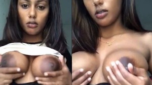 Beautiful Tamil woman revealing her large breast and beautiful body.