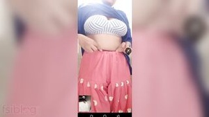 Big breasted Indian woman shows her large breasts and penis in the bathroom