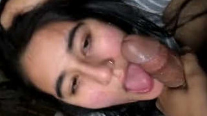 A beautiful woman wearing sexy socks is giving a blowjob.