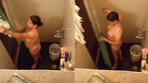 An adult Indian woman taking a bath.
