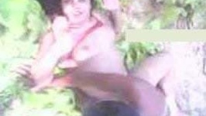 Scandalous MMS of rural woman enjoying rough sex outside.