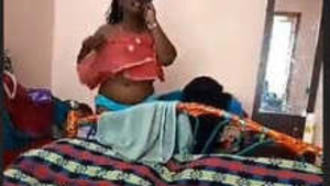 There is a video of a milf bhabhi with medium tits and her hubby recording her.