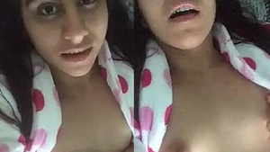 A teenage girl likes to play with her boobs and vagina on the webcam.