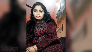 Sexy bhabhi showing off her big melons in this video.