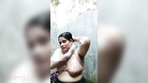 Married Bangladeshi house wife taking naked shower in outdoor bath in Bengali XXX video.