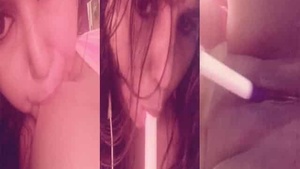 Beautiful woman with big breast pleases herself with a vibrator