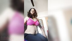 A mature, curvaceous Indian house wife with big breast shows her natural beauty in a self-portrait.