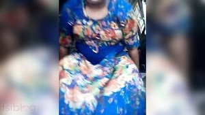 A beautiful South Asian woman poses fully and confidently for the camera.