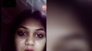 Young Indian woman taking selfies while she self-pleasure.