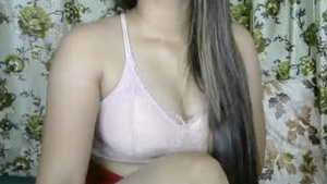 Beautiful college girl performs hot scenes in front of the camera.