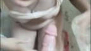 A beautiful Pakistani woman gives her husband a blowjob in the bathroom.