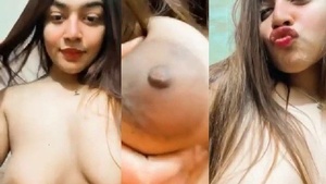 A hot Indian girl from Bangladesh showing her large breasts.