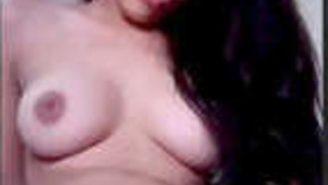 A Bengali college girl moans while her pussy is being licked and probed with a finger.