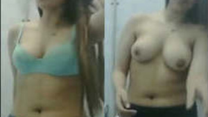 Pretty Indian girl undressing herself