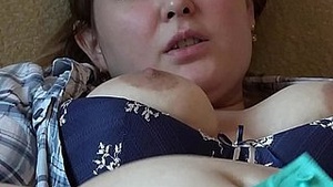 A plus size woman masturbates her clitoris and vagina simultaneously.