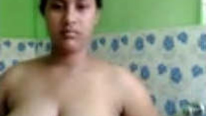 The beautiful big-boobed girl is showing off her body.