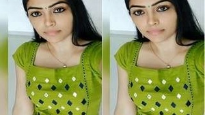 A hot Indian aunty showing her big cans in a housewives porn video