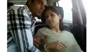 A young Indian college woman pleasuring herself and possibly someone else in a car.