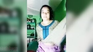 Pretty Bangladeshi woman performs a sexy strip-tease for MMS subscribers.