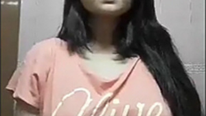 A shy Indian woman makes a sexy video for her man.