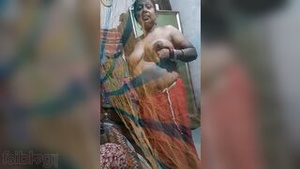 Topless pics of village aunty get her into trouble with desi wife