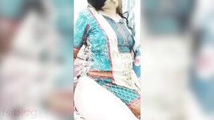 A Desi woman finger stimulates herself to orgasm.