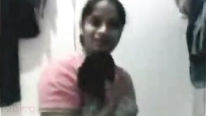 A sexy Bengali adult film scene featuring a beautiful college girl stripping for her boyfriend on camera.