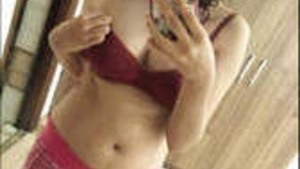 Young Indian girl starts undressing herself.