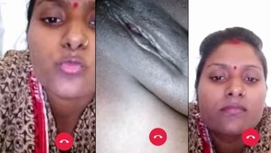 Beautiful traditional Indian woman flashing her private parts in front of the camera.