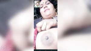 Married Indian house wife shows her large breasts during a video call with her husband.