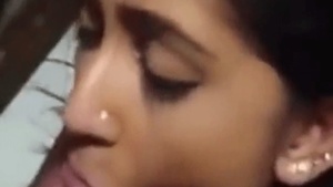 Young Indian woman gives blow job to her lover in a hotel room