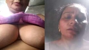 45+ desi MILF shows off her big cans in a sexy selfie strip tease.