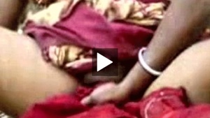 An Indian house wife and her husband’s friend in a village having sex.