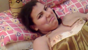 A shy, cute, and chubby Arab woman reveals her private parts to her loved one.