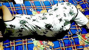 A young village beauty enjoys watching porn on her mobile device and pleasuring herself.