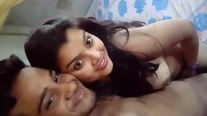 An Indian lover kisses and sucks on his girlfriend’s breasts while she gives him a blowjob.