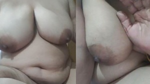 Big breasted Indian housewife performs a live webcam show.