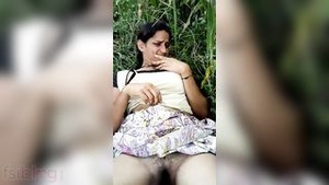 Hot Dehati MILF fingered and oiled outdoors in this naughty video.