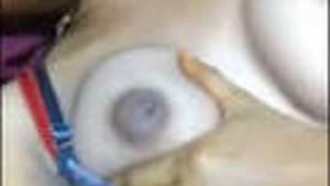 A girl from a South Asian country exposes her breasts.