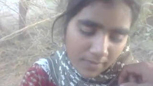 A village girl has sex with a man from her neighborhood outdoors.