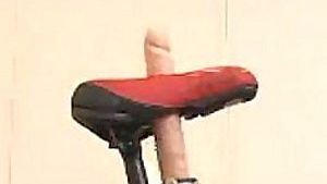 Beautiful Japanese woman pleasuring herself on a Siberian bicycle